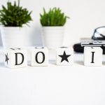 Inspiring office scene with 'Do It' blocks and plants, perfect for motivation.